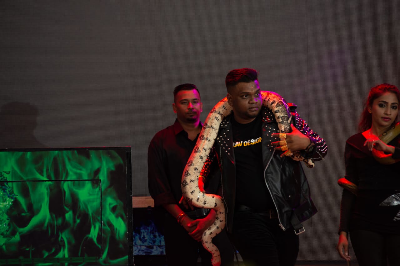Silan Magician performing a second live python stage illusion in Malaysia